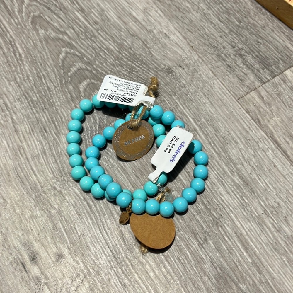 2 aqua colored stretch bead bracelets